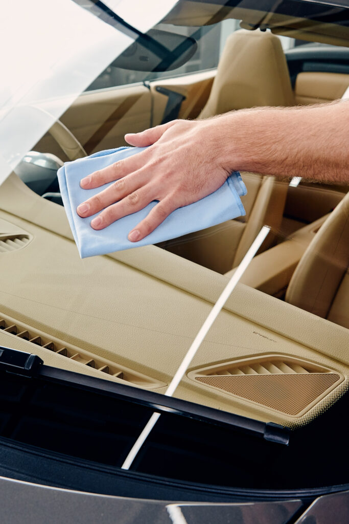 car window is getting cleaned