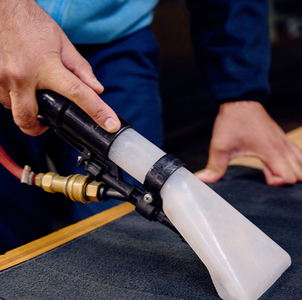 vacuuming car interior and removing car mat odour