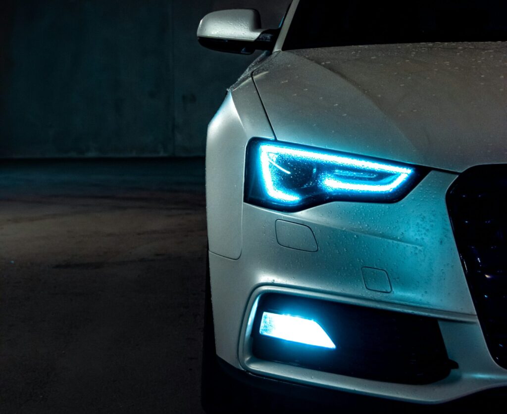 car headlight shining after detailing at Magic Hand car wash