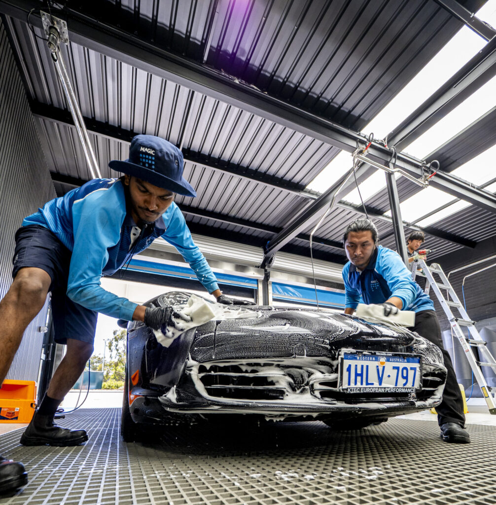 car getting cleaned in Magic hand car wash Store